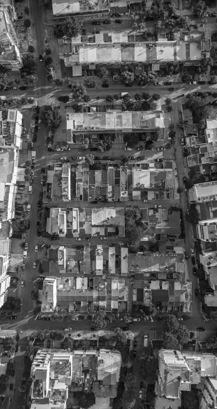 An aerial view of a city street in black and white
