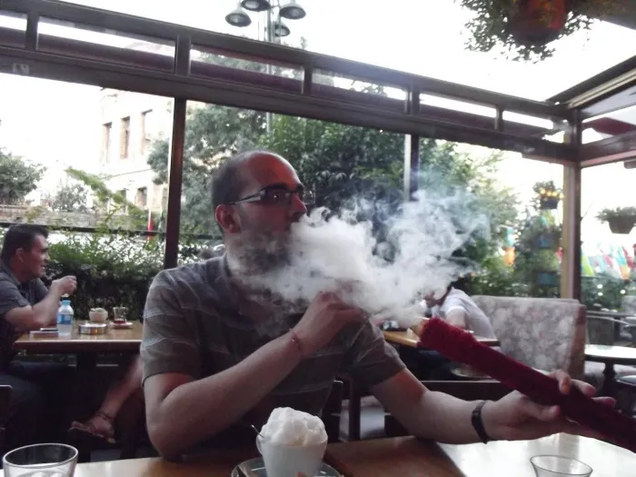 Man smoking a shisha pipe