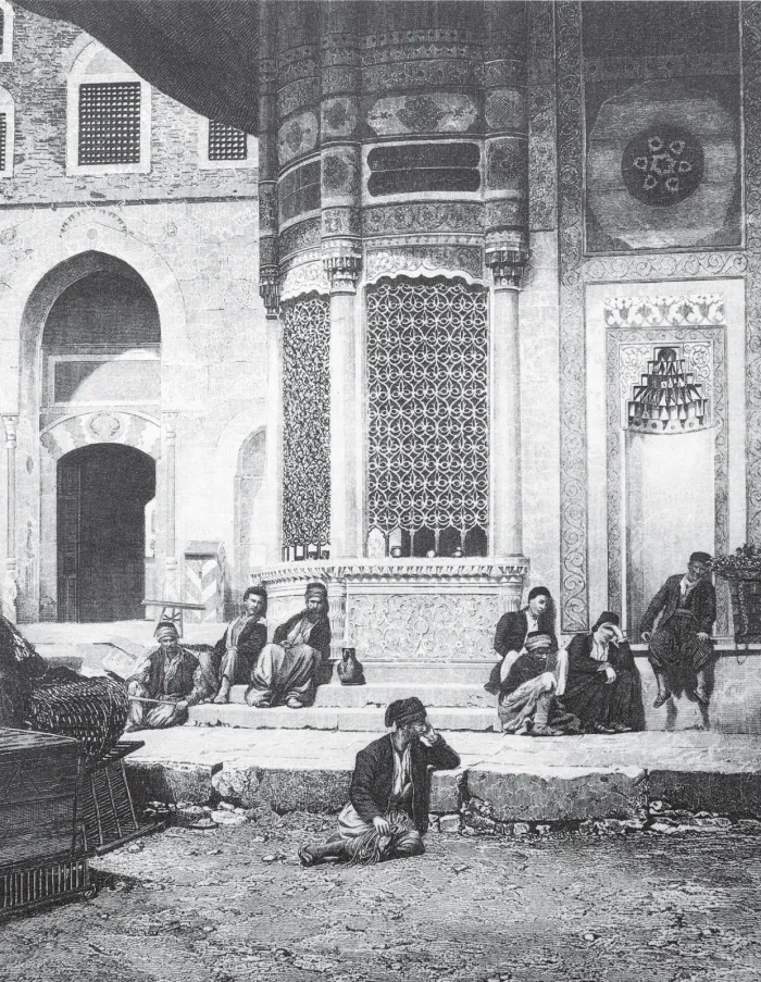 Street sellers resting on the steps of a building in Istanbul