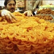 Man selling Pakistani sweet treats