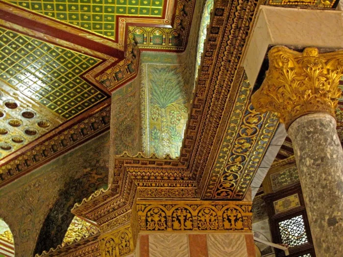 Gold and green interior of the Al-Aqsa Mosque