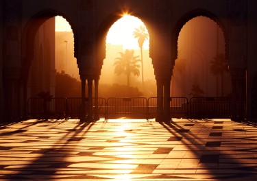 Great mosque of Hassan 2 at sunset in Casablanca, Morocco. Beautiful Arches of the Arab mosque in the sunset, sunlight rays