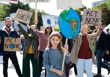 People with placards and posters on a global strike for climate change.