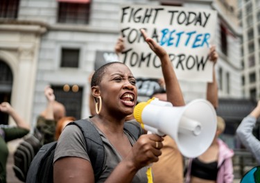 Activists doing a demonstration outdoors