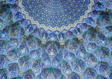 Ceiling and wall tilework at the Shah Mosque on Imam Square, Isfahan, Iran. The mosque is also known as Imam Mosque and Jaame' Abbasi Mosque. It is one of the masterpieces of Iranian/Persian Architecture and an excellent example of Islamic era architecture of Iran and also one of the top sights of the contry.
