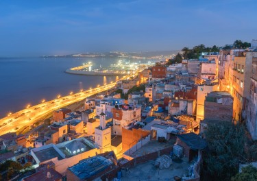 aerial view of the Medina from the phoenician tombs near body of water during night time